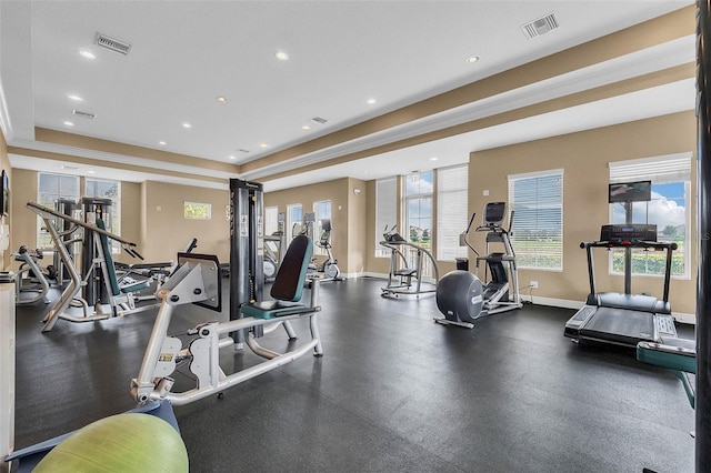 15477 Blackbead St, Winter Garden, FL 34787 - gym featuring plenty of natural light, recessed lighting, baseboards, and a raised ceiling