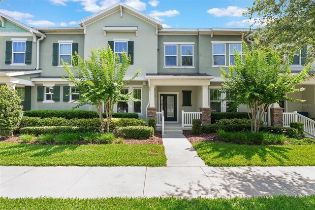 15477 Blackbead St, Winter Garden, FL 34787 - multi unit property with stucco siding and covered porch