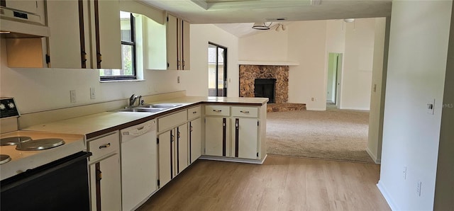 2008 Juniper Dr, Edgewater, FL 32141 - kitchen featuring white dishwasher, electric range oven, a sink, open floor plan, and light countertops