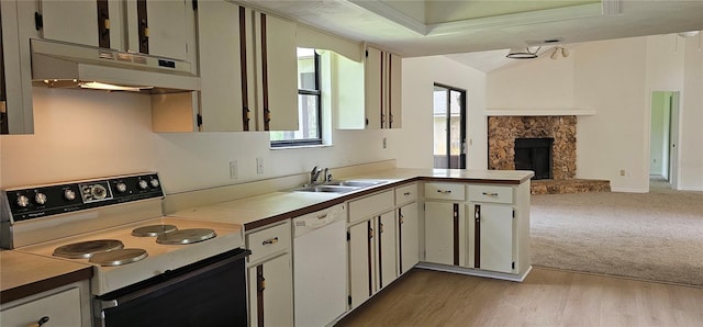 2008 Juniper Dr, Edgewater, FL 32141 - kitchen featuring white appliances, under cabinet range hood, a sink, open floor plan, and a stone fireplace