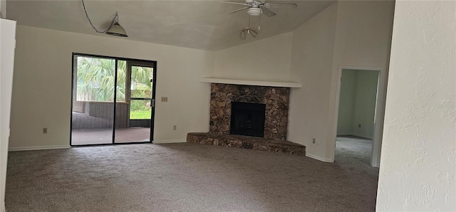 2008 Juniper Dr, Edgewater, FL 32141 - unfurnished living room featuring carpet flooring, ceiling fan, a fireplace, vaulted ceiling, and baseboards