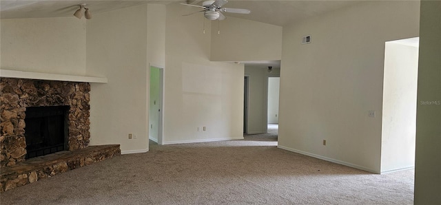 2008 Juniper Dr, Edgewater, FL 32141 - unfurnished living room featuring carpet floors, high vaulted ceiling, ceiling fan, a stone fireplace, and baseboards