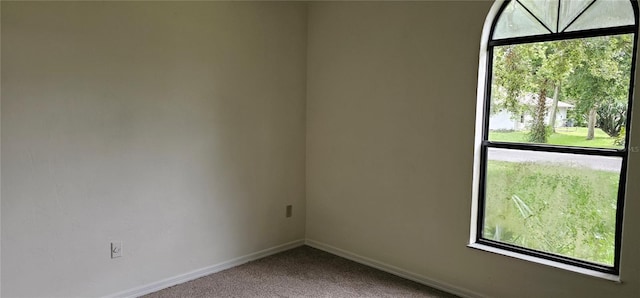2008 Juniper Dr, Edgewater, FL 32141 - empty room with carpet floors, baseboards, and healthy amount of natural light