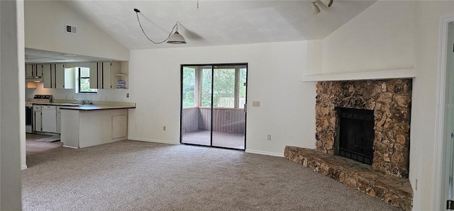 2008 Juniper Dr, Edgewater, FL 32141 - unfurnished living room with carpet, a stone fireplace, a sink, baseboards, and high vaulted ceiling