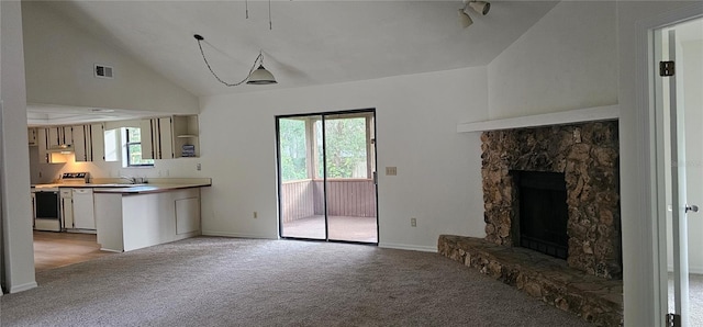 2008 Juniper Dr, Edgewater, FL 32141 - unfurnished living room featuring light colored carpet, a stone fireplace, baseboards, and high vaulted ceiling