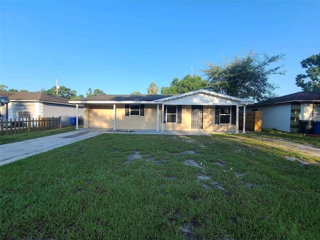 3217 Deerfield Dr, Tampa, FL 33619 - ranch-style house with driveway and a carport