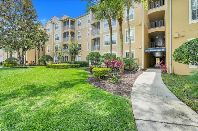 2821 Almaton Loop Unit 105, Kissimmee, FL 34747 - view of apartment building / complex