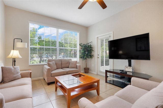 2821 Almaton Loop Unit 105, Kissimmee, FL 34747 - living area with ceiling fan, light tile patterned floors, and baseboards