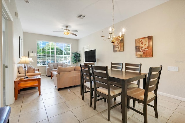 2821 Almaton Loop Unit 105, Kissimmee, FL 34747 - dining room with ceiling fan, light tile patterned floors, baseboards, and a chandelier