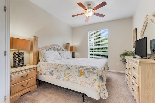 2821 Almaton Loop Unit 105, Kissimmee, FL 34747 - bedroom featuring light carpet, baseboards, and ceiling fan