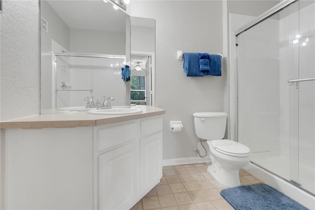2821 Almaton Loop Unit 105, Kissimmee, FL 34747 - full bathroom with toilet, a stall shower, vanity, and a textured wall