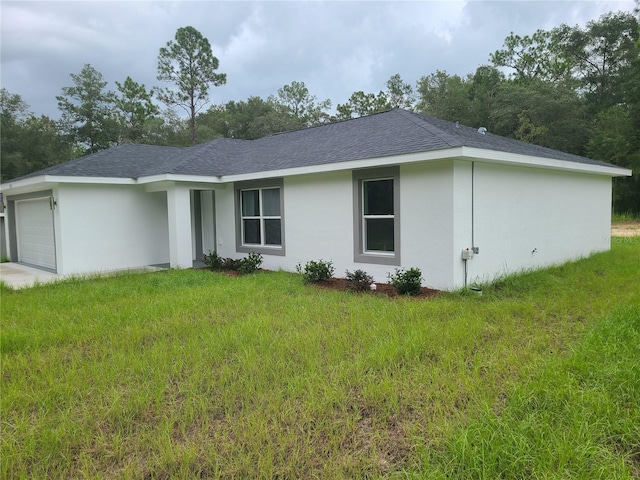 4333 SW 157th Ter, Ocala, FL 34481 - ranch-style house featuring a shingled roof, an attached garage, and a front lawn