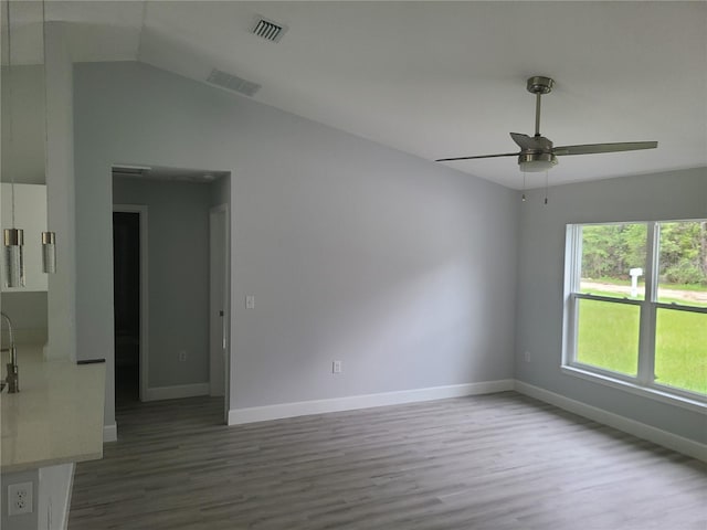 4333 SW 157th Ter, Ocala, FL 34481 - spare room featuring wood finished floors, a ceiling fan, baseboards, and lofted ceiling