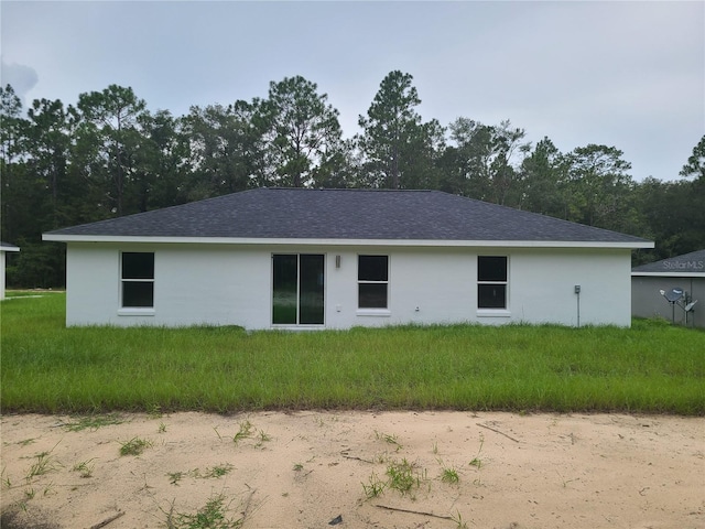 4333 SW 157th Ter, Ocala, FL 34481 - rear view of house featuring a shingled roof and stucco siding