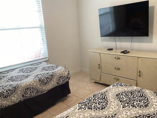2305 Butterfly Palm Way Unit 304, Kissimmee, FL 34747 - bedroom featuring light tile patterned flooring