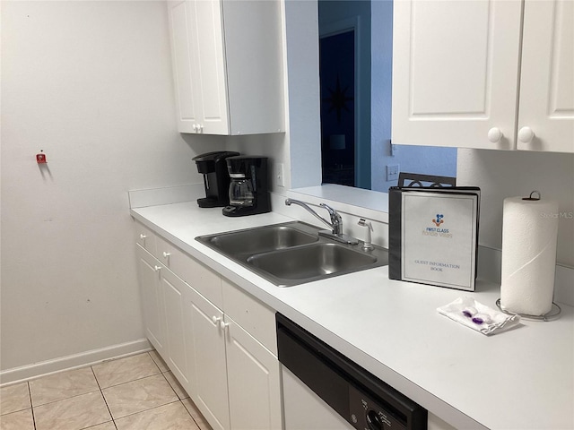 2305 Butterfly Palm Way Unit 304, Kissimmee, FL 34747 - kitchen with white dishwasher, a sink, white cabinetry, and light countertops