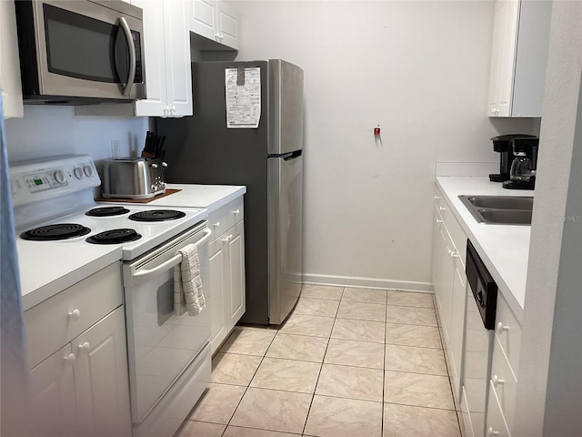 2305 Butterfly Palm Way Unit 304, Kissimmee, FL 34747 - kitchen featuring white appliances, white cabinetry, light countertops, and a sink