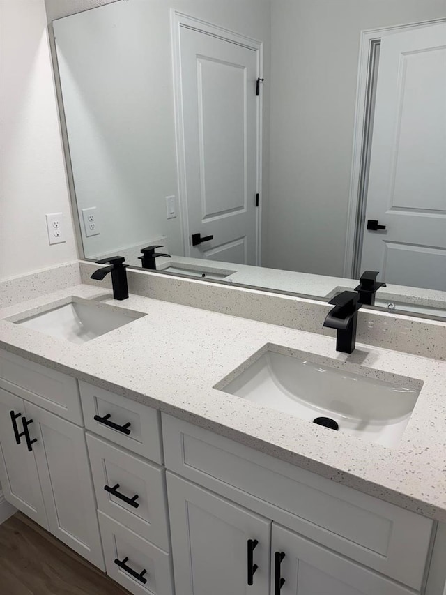 706 Marion Oaks Mnr, Ocala, FL 34473 - full bathroom with double vanity and wood finished floors