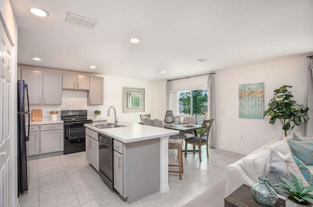 2352 W Newhope Ln, Citrus Springs, FL 34434 - kitchen featuring black appliances, gray cabinets, a sink, open floor plan, and light countertops