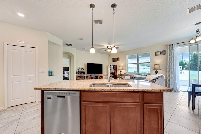 998 Sorrel St NW, Palm Bay, FL 32907 - kitchen featuring stainless steel dishwasher, a sink, open floor plan, a ceiling fan, and a textured ceiling