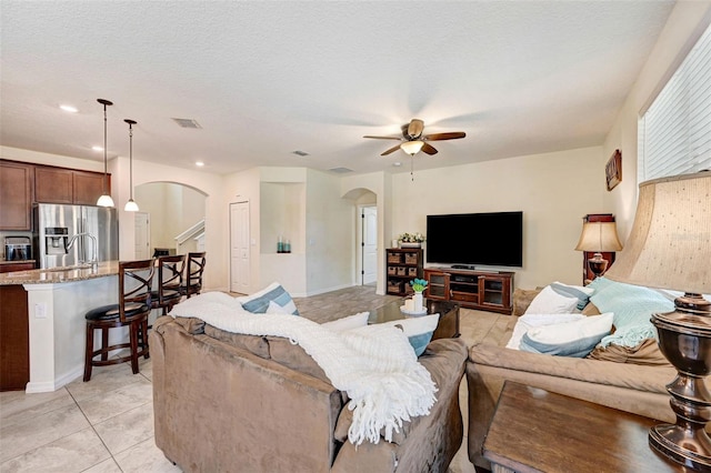998 Sorrel St NW, Palm Bay, FL 32907 - living area with arched walkways, ceiling fan, light tile patterned flooring, and recessed lighting