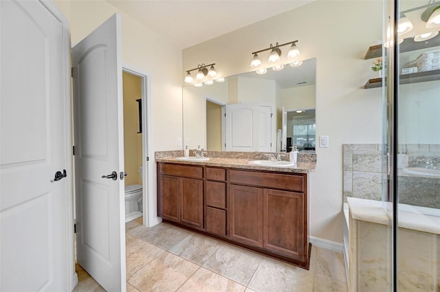 998 Sorrel St NW, Palm Bay, FL 32907 - full bath featuring double vanity, toilet, and baseboards