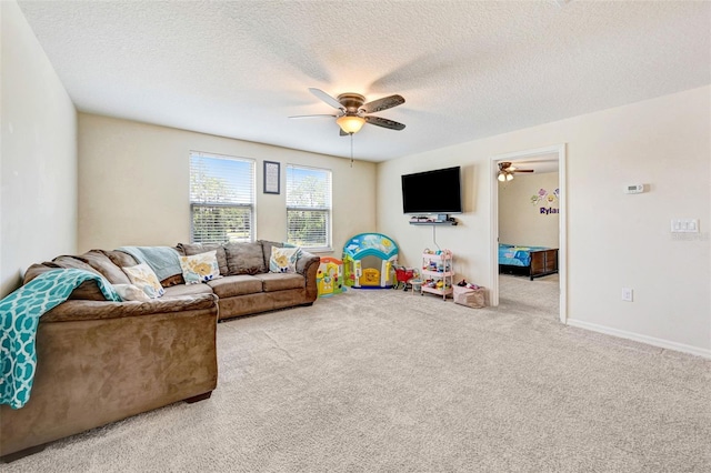 998 Sorrel St NW, Palm Bay, FL 32907 - living room featuring ceiling fan, carpet flooring, a textured ceiling, and baseboards
