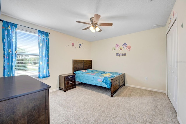 998 Sorrel St NW, Palm Bay, FL 32907 - carpeted bedroom featuring a closet, baseboards, a ceiling fan, and a textured ceiling
