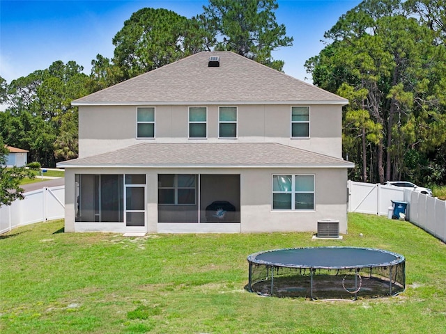998 Sorrel St NW, Palm Bay, FL 32907 - back of house featuring a trampoline, a gate, a sunroom, a shingled roof, and central AC unit