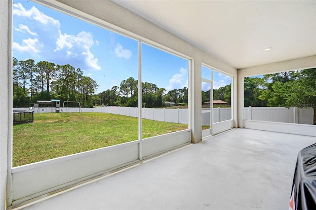 998 Sorrel St NW, Palm Bay, FL 32907 - unfurnished sunroom featuring view of wooded area