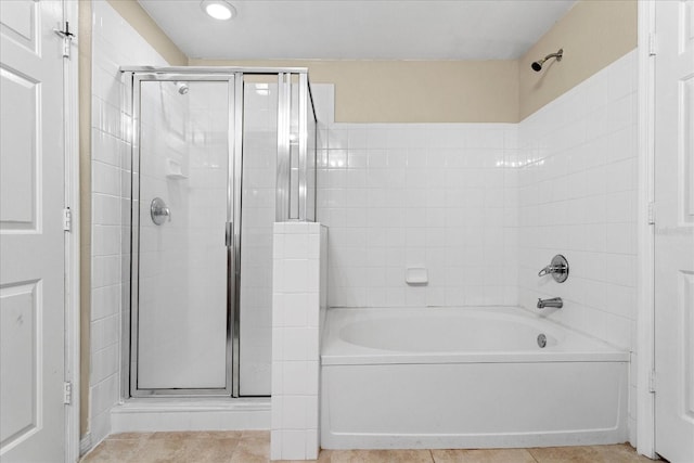 1101 Vintage Village Ln Unit 101, Ocoee, FL 34761 - bathroom with a stall shower, a tub to relax in, and tile patterned flooring