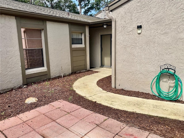 1110 Woodbine St, Fern Park, FL 32730 - property entrance featuring stucco siding and a patio area