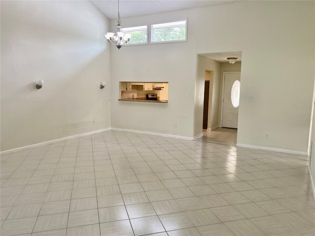 1110 Woodbine St, Fern Park, FL 32730 - unfurnished living room with a chandelier, high vaulted ceiling, light tile patterned flooring, and baseboards