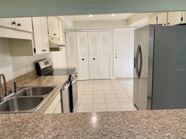 1110 Woodbine St, Fern Park, FL 32730 - kitchen with appliances with stainless steel finishes, under cabinet range hood, a sink, light tile patterned floors, and recessed lighting