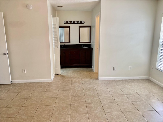 1110 Woodbine St, Fern Park, FL 32730 - unfurnished room featuring light tile patterned flooring, baseboards, and a sink