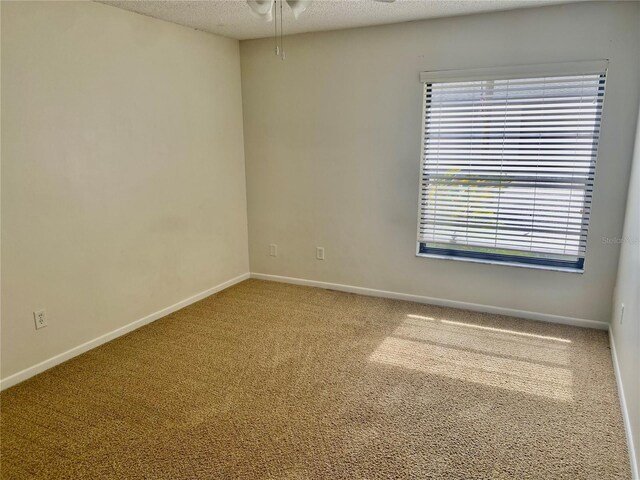 1110 Woodbine St, Fern Park, FL 32730 - carpeted empty room with ceiling fan, baseboards, and a textured ceiling