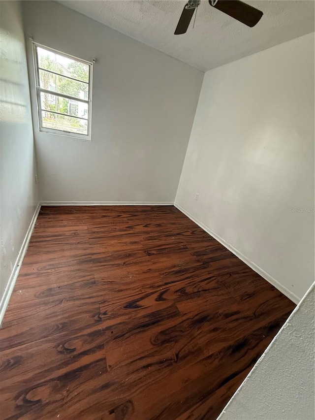 914 SW 8th Ave Unit 14, Gainesville, FL 32601 - empty room featuring ceiling fan, dark wood-style floors, baseboards, and a textured ceiling