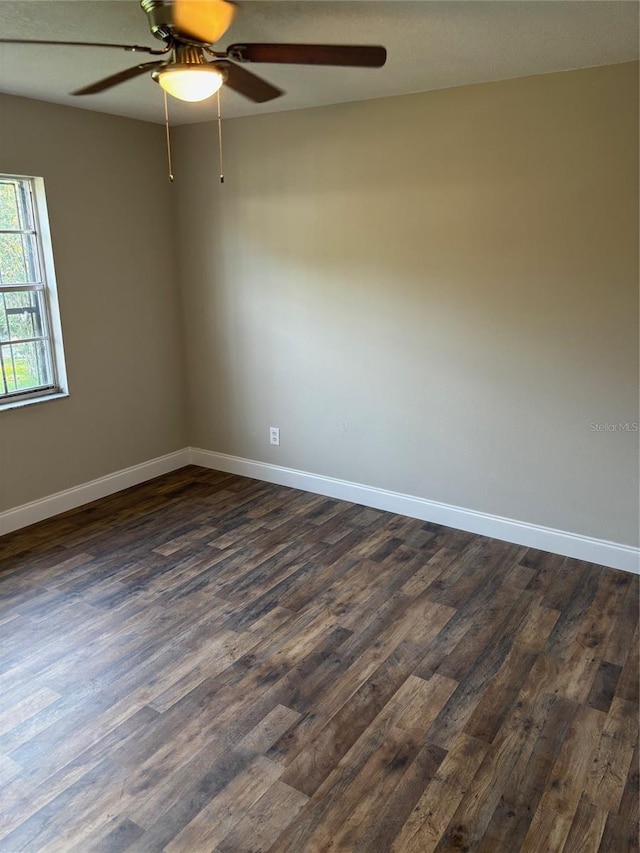 2085 San Jose Blvd, Orlando, FL 32808 - unfurnished room with dark wood-style floors, a ceiling fan, and baseboards