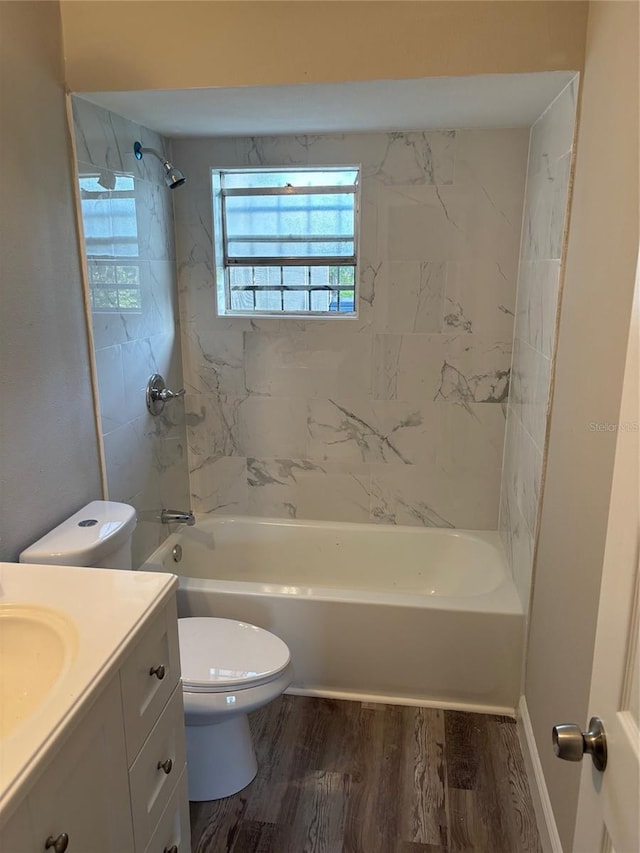 2085 San Jose Blvd, Orlando, FL 32808 - full bath with vanity, toilet, shower / bath combination, and wood finished floors