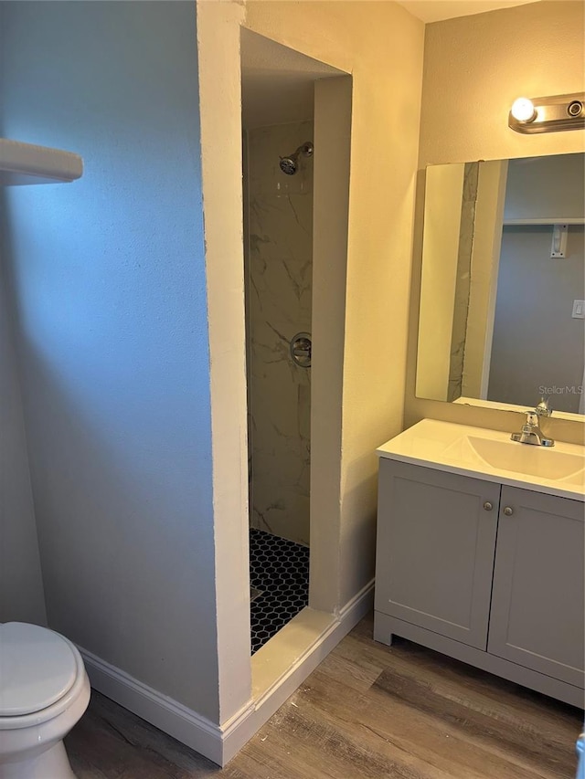 2085 San Jose Blvd, Orlando, FL 32808 - full bath featuring a marble finish shower, wood finished floors, toilet, and vanity