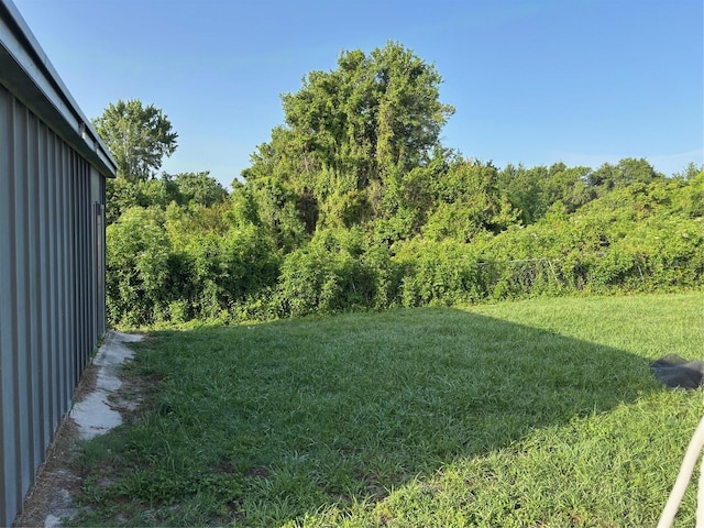 2085 San Jose Blvd, Orlando, FL 32808 - view of grassy yard with a wooded view