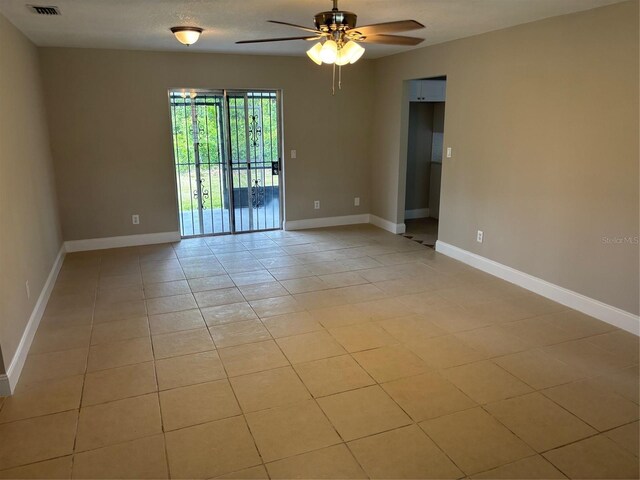 2085 San Jose Blvd, Orlando, FL 32808 - empty room featuring a ceiling fan and light tile patterned floors