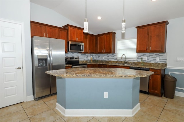 1061 Citrus Landings Blvd, Davenport, FL 33837 - kitchen with appliances with stainless steel finishes, a sink, tasteful backsplash, light tile patterned floors, and vaulted ceiling