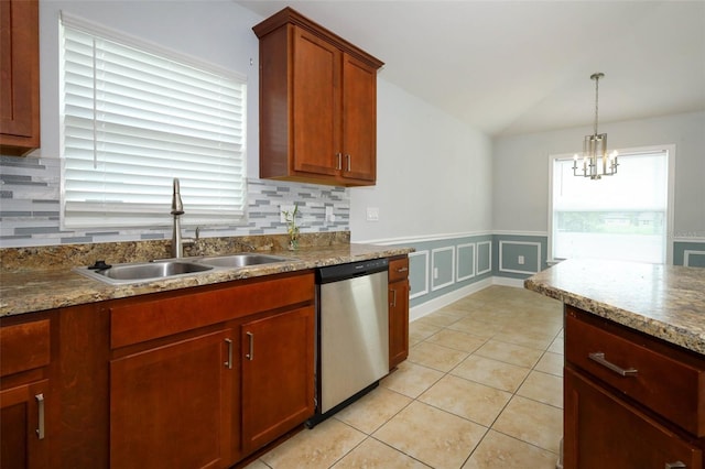 1061 Citrus Landings Blvd, Davenport, FL 33837 - kitchen featuring dishwasher, a sink, backsplash, lofted ceiling, and plenty of natural light