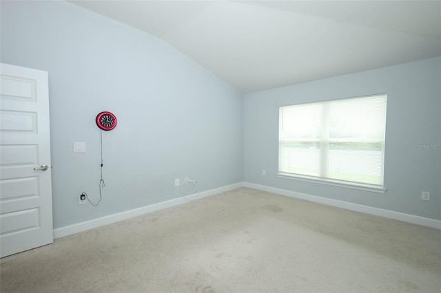 1061 Citrus Landings Blvd, Davenport, FL 33837 - carpeted spare room featuring vaulted ceiling and baseboards