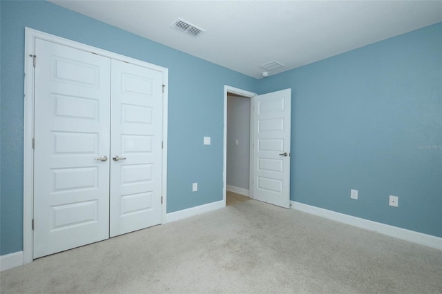 1061 Citrus Landings Blvd, Davenport, FL 33837 - unfurnished bedroom featuring carpet flooring, baseboards, and a closet