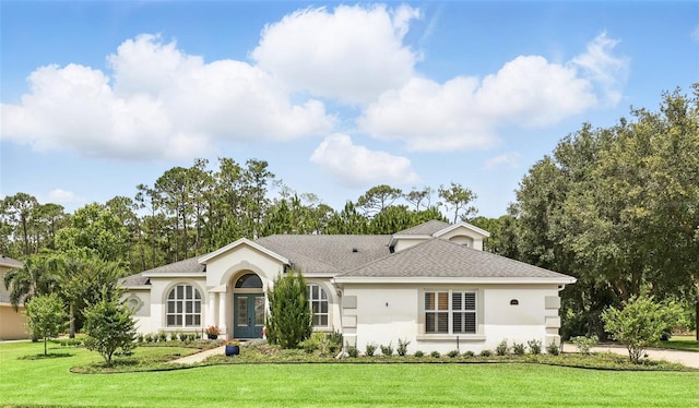 2908 Lee Shore Loop, Orlando, FL 32820 - view of front of house with stucco siding, a front yard, and a shingled roof