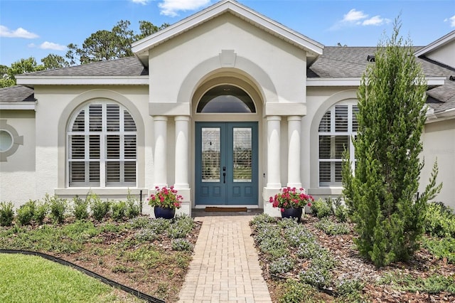 2908 Lee Shore Loop, Orlando, FL 32820 - doorway to property with roof with shingles, french doors, and stucco siding