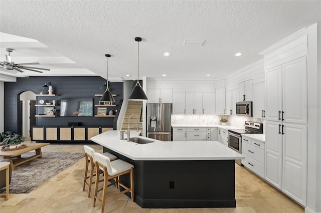 2908 Lee Shore Loop, Orlando, FL 32820 - kitchen with stainless steel appliances, a sink, ceiling fan, light countertops, and backsplash