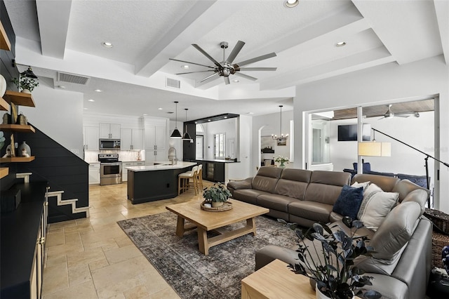 2908 Lee Shore Loop, Orlando, FL 32820 - living room featuring a ceiling fan, stone tile flooring, recessed lighting, and beam ceiling